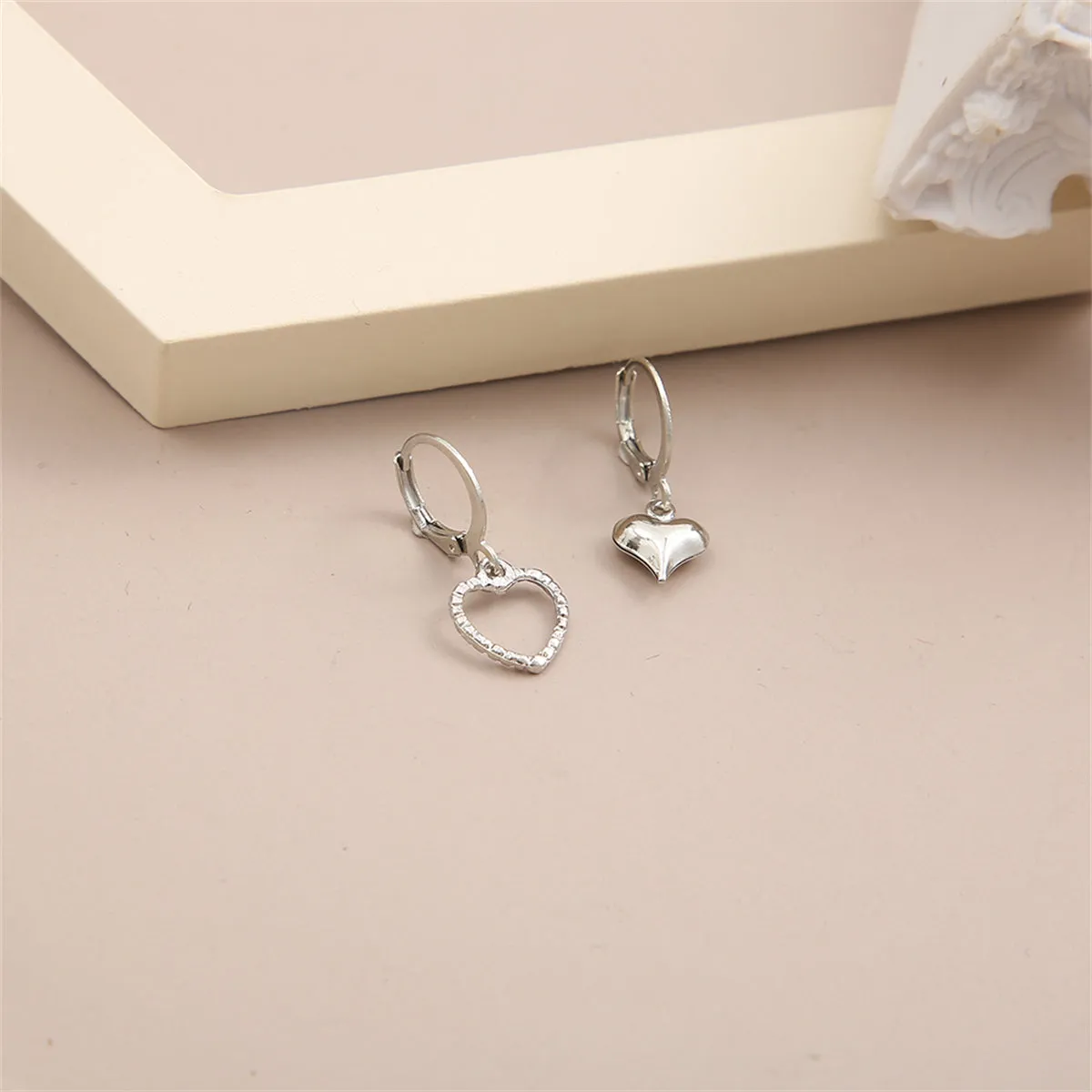 Silver-Plated Mismatching Heart Huggie Earrings