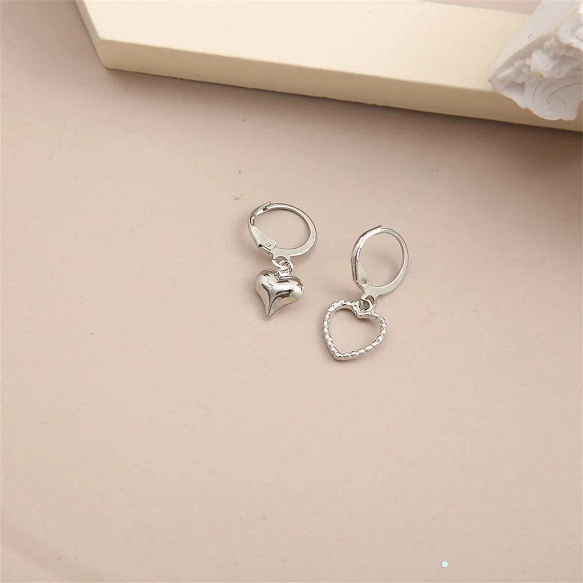 Silver-Plated Mismatching Heart Huggie Earrings