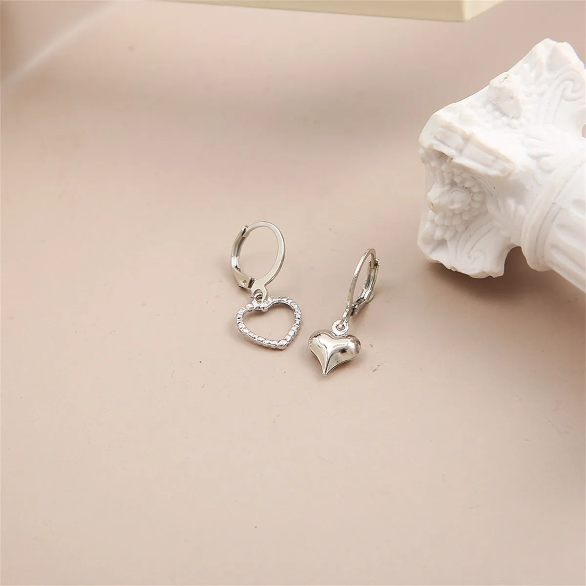 Silver-Plated Mismatching Heart Huggie Earrings